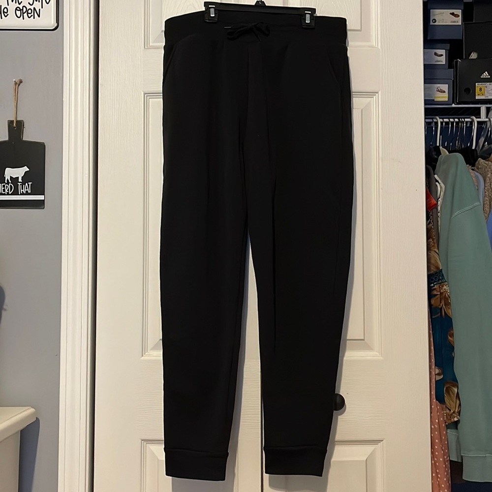 Black sweatpants. With pockets.